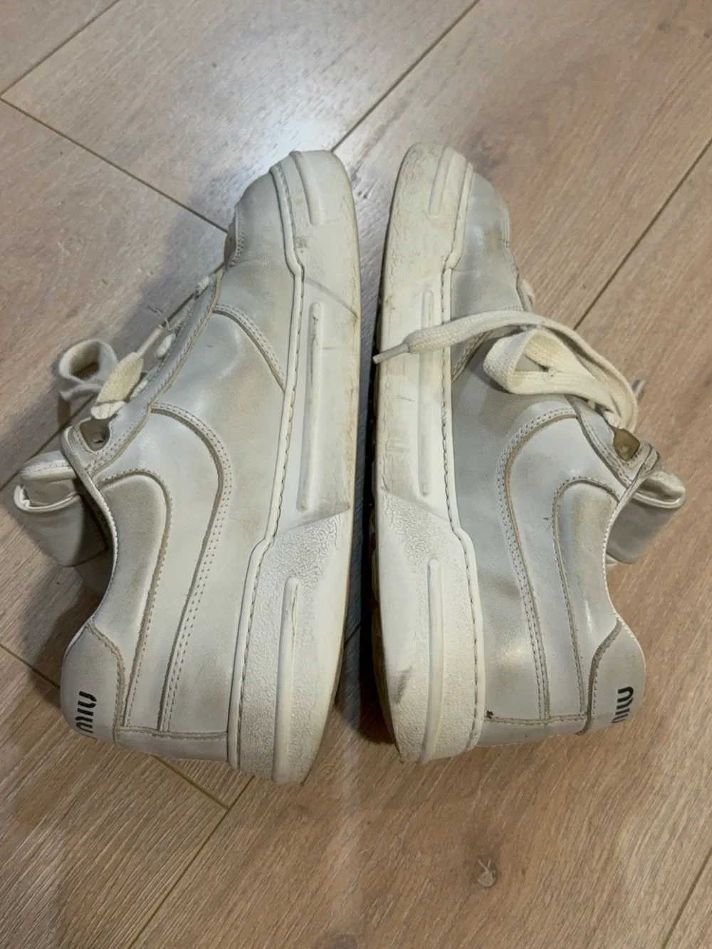 Miu Miu Off-White Leather Sneakers with Gold Trim